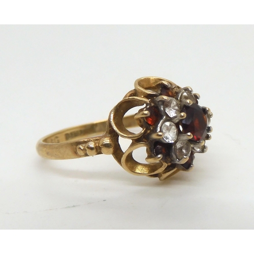 480 - Five 9ct gold rings. A 9ct gold pink shell cameo ring, size H, a retro 9ct red and clear gem cluster... 