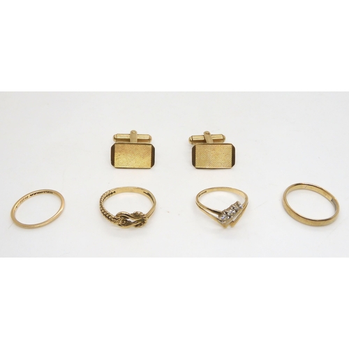 505 - A pair of 9ct gold cufflinks, and four 9ct gold rings (two wedding rings sizes J and M1/2, Gem ... 