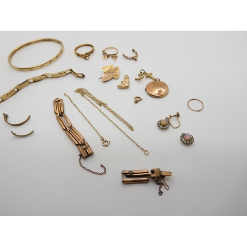 507 - A collection of 9ct gold items to include a bangle, a coin mount, watch straps etc, weight all toget... 