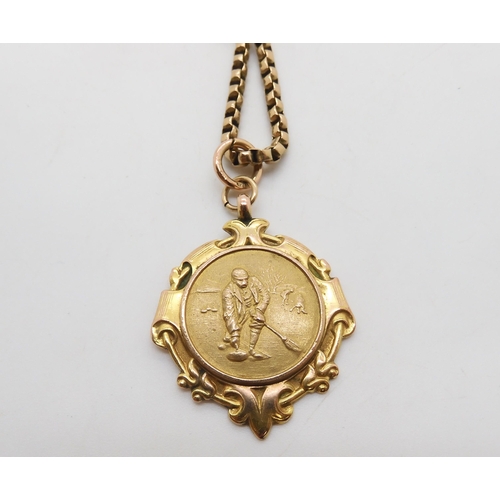 508 - A 9ct gold curling medallion on a vintage 9ct chain, length 46cm, weight together 18gms