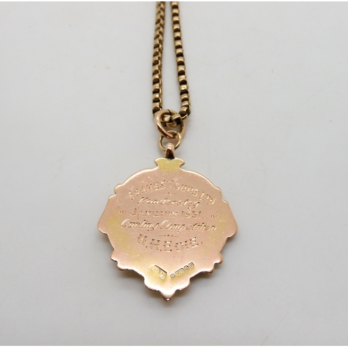 508 - A 9ct gold curling medallion on a vintage 9ct chain, length 46cm, weight together 18gms