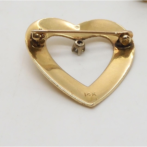 510 - A 14k gold diamond set heart shaped brooch, weight 2.8gms, a yellow metal cameo brooch, and mabe pea... 