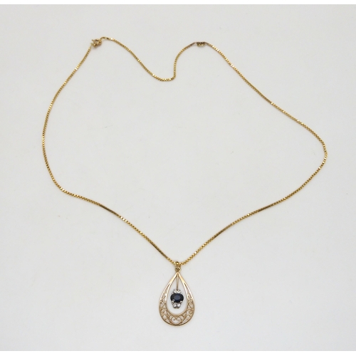 511 - A 9ct gold sapphire and diamond pendant, length of pendant 3cm, length of box chain 50cm, weight 4.8... 