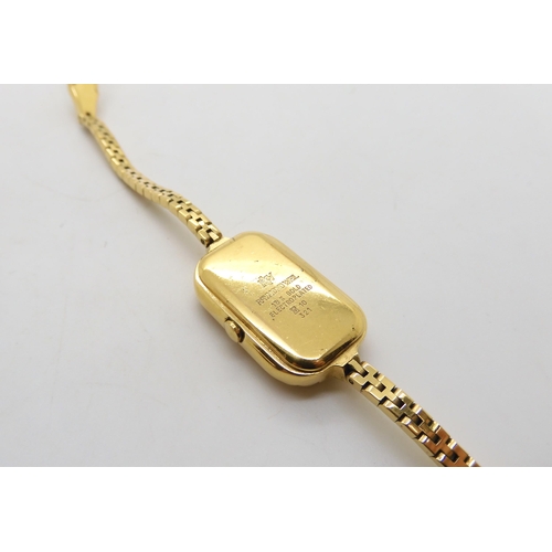 512 - A 9ct gold three colour gold bracelet, length 18cm, weight 6.4gms, and a Raymond Weil gold plated la... 