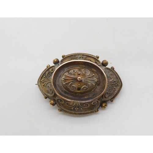 522 - A Victorian yellow metal Etruscan revival style brooch with locket back, length 4.5cm, weight 11.1gm... 