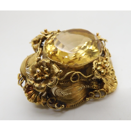 524 - A yellow metal filigree brooch set with a large citrine of approx 23mm x 1.8mm, weight 13.3gms