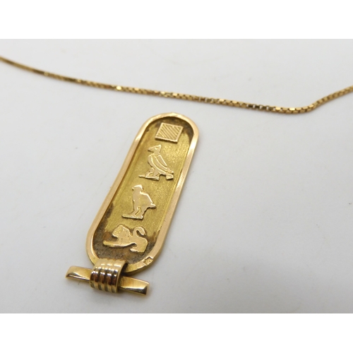 529 - A Hieroglyph style pendant (af) with Arabic hallmarks and a 18ct gold box chain, length 46cm, weight... 