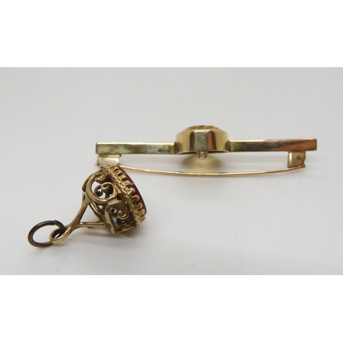 536 - A 9ct gold fob seal and a yellow metal bar brooch set with a citrine, weight 9.5gms