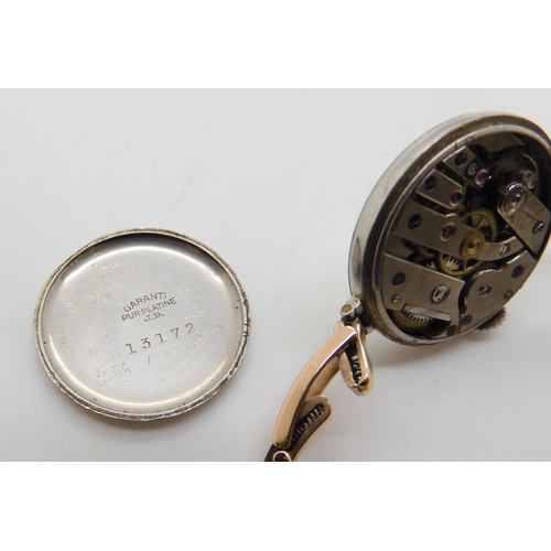 539 - A yellow and white metal vintage ladies watch the case stamped 'Pur Platine' and the strap engraved ... 