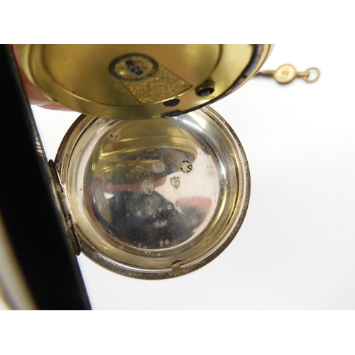 577 - A silver open face pocket watch with a decorative silver dial, and silver fob chain, diameter of the... 