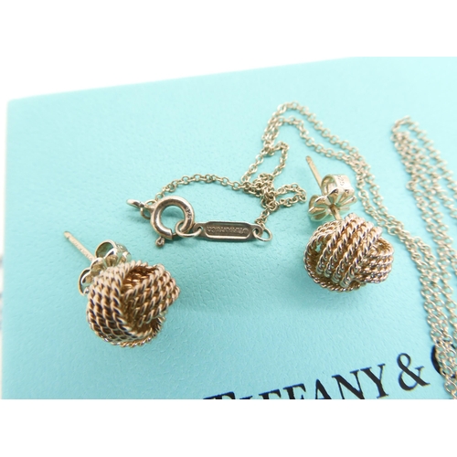 582 - A Tiffany & Co knot pendant and matching earrings, both signed, together with other items of sil... 