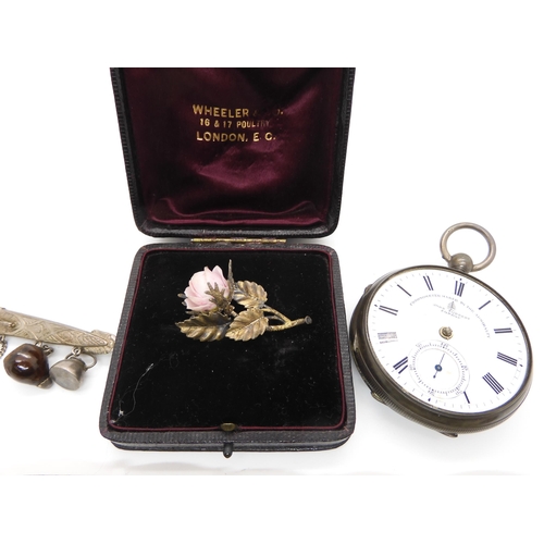 587 - A continental silver porcelain rose brooch in original box, a silver pearl brooch, a base metal Iain... 