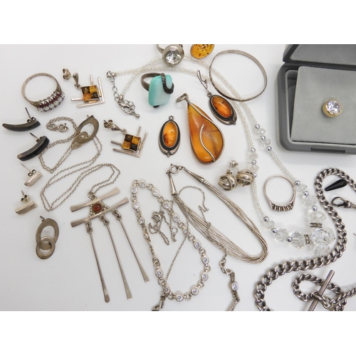 588 - A collection of silver and white metal jewellery to include amber set items, two retro pendants and ... 