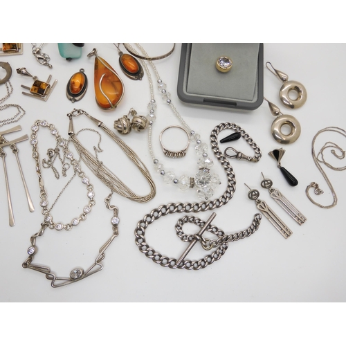 588 - A collection of silver and white metal jewellery to include amber set items, two retro pendants and ... 