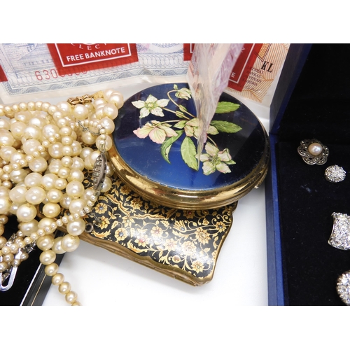 592 - A collection of compacts to include a Navy cap example, a white metal sliding lipstick and mirror co... 