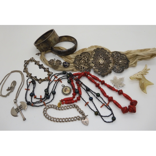 604 - Two silver bangles, a Max Neiger red glass bead necklace, a Chinese silver buckle, and other items