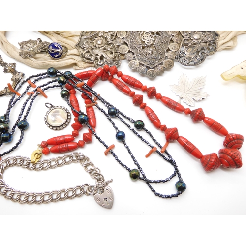 604 - Two silver bangles, a Max Neiger red glass bead necklace, a Chinese silver buckle, and other items