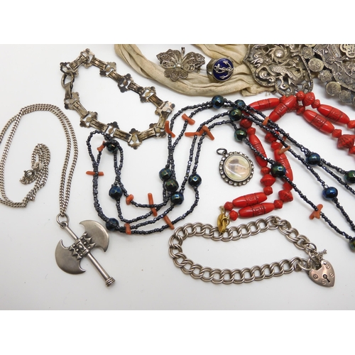 604 - Two silver bangles, a Max Neiger red glass bead necklace, a Chinese silver buckle, and other items