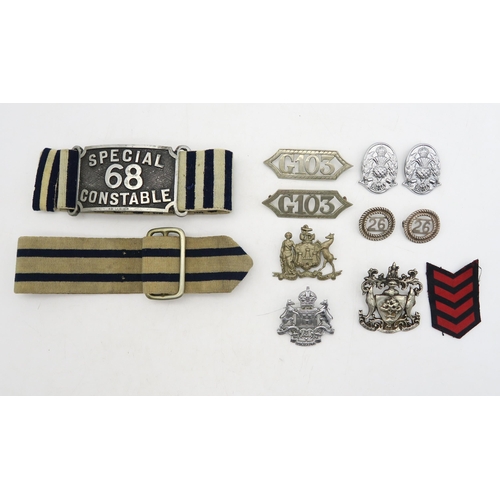 311 - A Special Constable's striped armband, another similar buckled armband, police cap badges (including... 