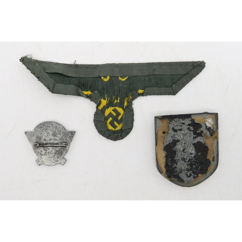 313 - A WW2 German Third Reich Kriegsmarine chest eagle cloth patch, together with a tropical pith helmet ... 