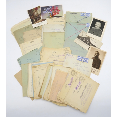 313A - A collection of WW2 German war post, largely dated 1943, together with a quantity of framed photogra... 