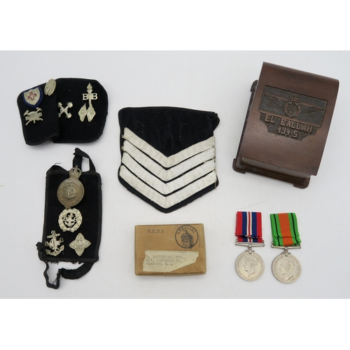 319 - A WW2 Defence Medal and War Medal pair, in original packaging addressed to 