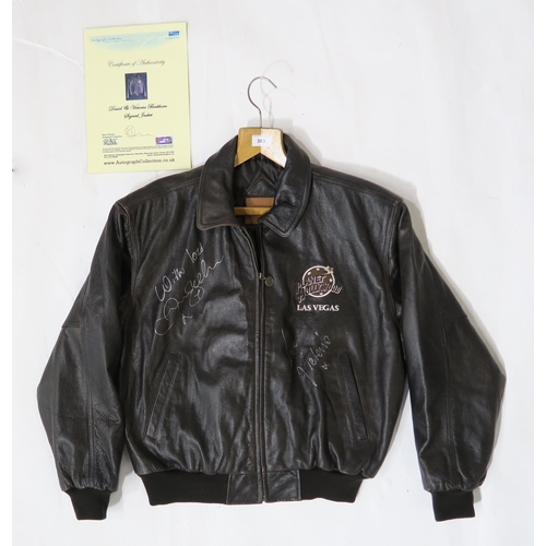 383 - A Planet Hollywood leather bomber jacket (size M), autographed by David and Victoria Beckham, with a... 