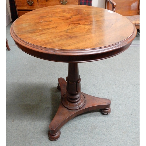 11 - A Victorian rosewood circular topped occasional table on turned column base terminating in trefoil b... 