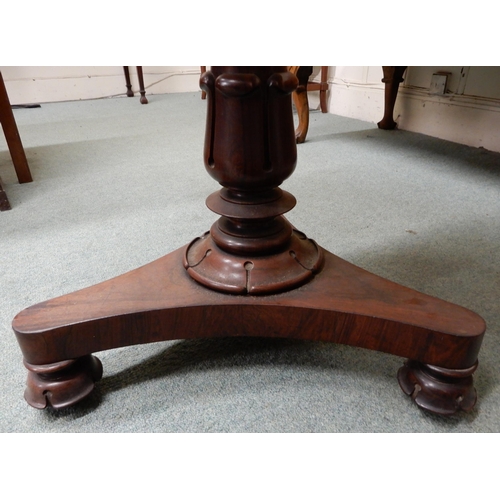 11 - A Victorian rosewood circular topped occasional table on turned column base terminating in trefoil b... 