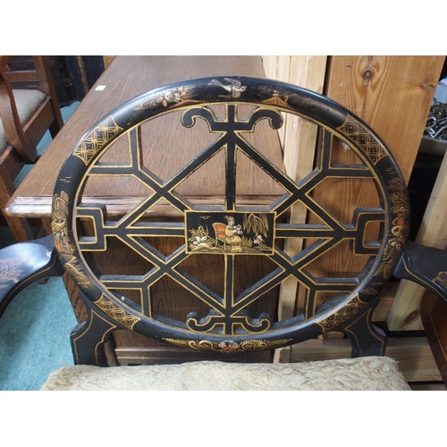 68 - A 19th century Oriental ebonised open armchair with fret work splat on ball and claw supports, 78cm ... 