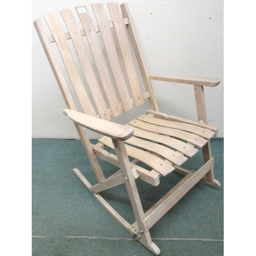 78 - A 20th century limed folding porch rocker with slated back seat, 94cm high x 59cm wide x 69cm deep