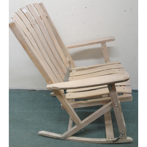 78 - A 20th century limed folding porch rocker with slated back seat, 94cm high x 59cm wide x 69cm deep