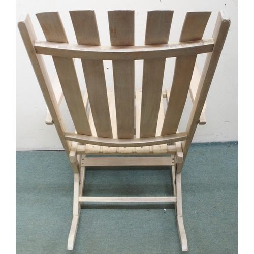 78 - A 20th century limed folding porch rocker with slated back seat, 94cm high x 59cm wide x 69cm deep