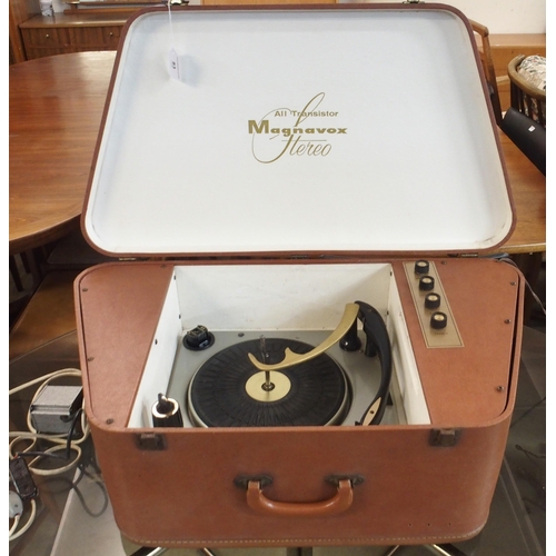 83 - A mid 20th century brown vinyl cased all transistor Magnavox portable stereo