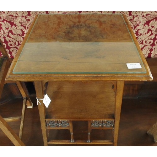 91 - A late 19th/early 20th century two tier side table in the manner of Liberty & Co with Mushavabie... 