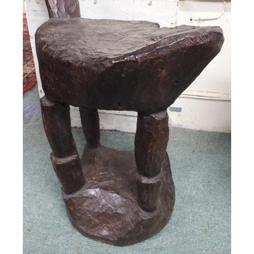 94 - A lot comprising an east African hardwood chair with high back over carved seat and support, 115cm h... 