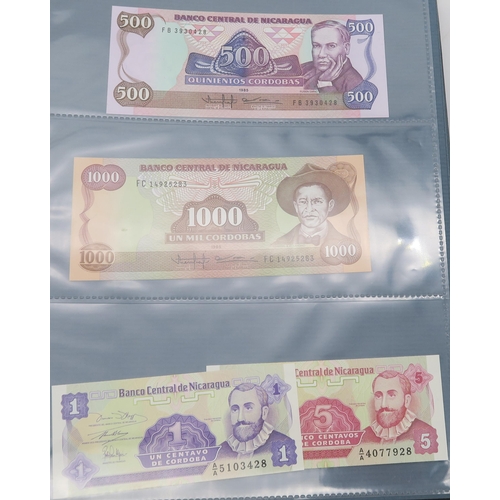 308 - BANK NOTES an extensive collection of uncirculated worldwide bank notes in four presentation folders... 