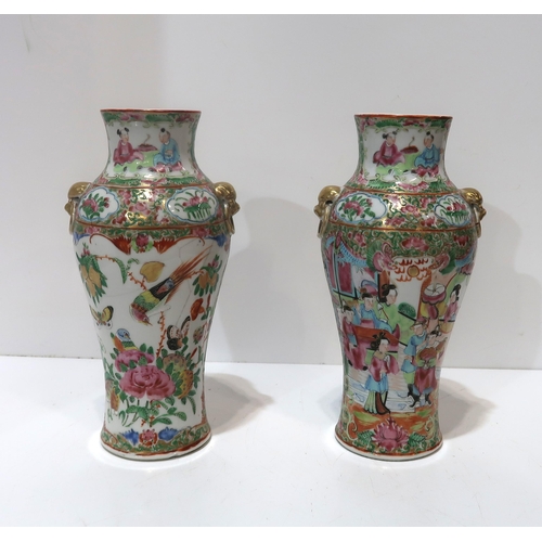 197 - A pair of Chinese export famille rose canton vases, each with figural decoration