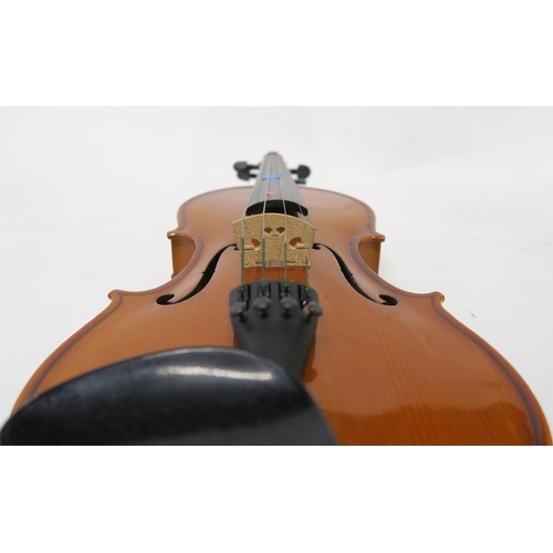 327 - A two piece back violin by Stentor Romania with a bow and case, strings etc