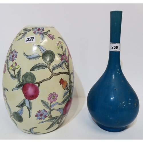 259 - A Chinese turquoise glazed bottle vase, together with another vase decorated with pommegranates