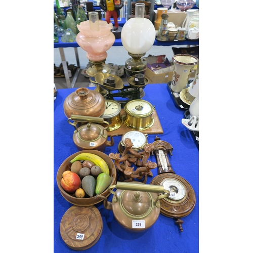 269 - A collection of copper and brass items including kettles, Schatz clock and barometer, scales, two oi... 