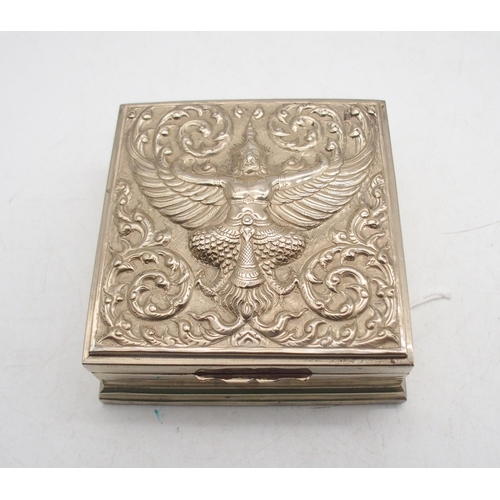 320 - Two Thai white metal boxes, both with embossed decoration of deities amongst flames, the cylindrical... 