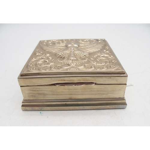 320 - Two Thai white metal boxes, both with embossed decoration of deities amongst flames, the cylindrical... 