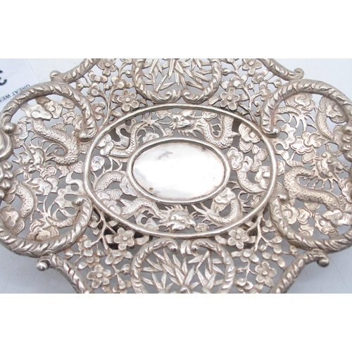 321 - A Chinese export silver footed dish, by Wang Hing, the body with pierced floral openwork, the centre... 