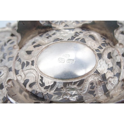 321 - A Chinese export silver footed dish, by Wang Hing, the body with pierced floral openwork, the centre... 