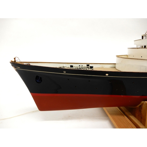 467 - A model ship in the manner of The Royal Yacht Britannia on stand, 54cm high x 130cm long x 20cm deep... 