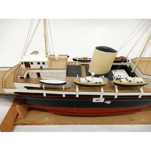 467 - A model ship in the manner of The Royal Yacht Britannia on stand, 54cm high x 130cm long x 20cm deep... 