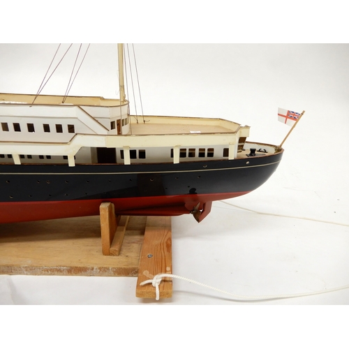 467 - A model ship in the manner of The Royal Yacht Britannia on stand, 54cm high x 130cm long x 20cm deep... 