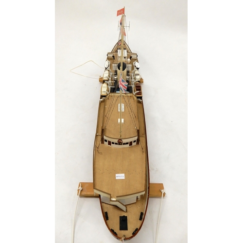 467 - A model ship in the manner of The Royal Yacht Britannia on stand, 54cm high x 130cm long x 20cm deep... 