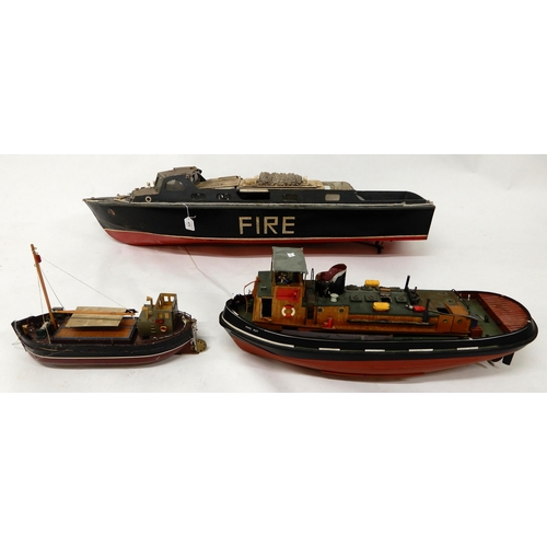 473 - A lot of three assorted model boats, fire rescue craft fitted with petrol motor, 118cm long (46.5